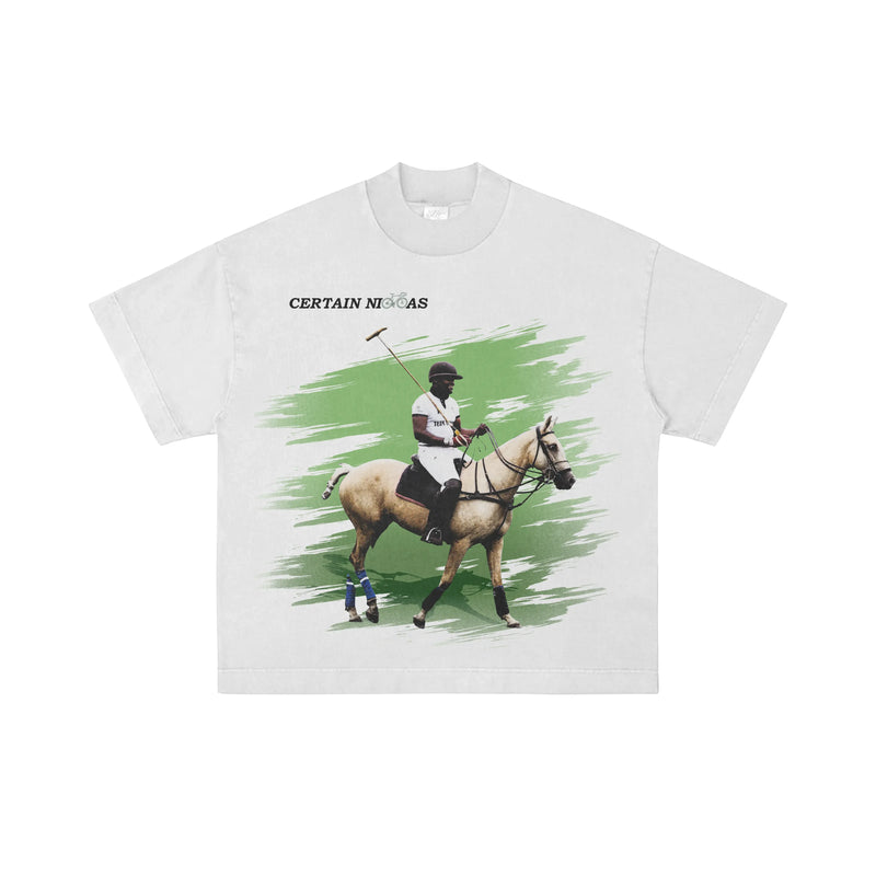 White oversized graphic T-shirt featuring a person on a horse with green splash design, Certain Necessities logo visible – premium West Coast streetwear for LA, San Diego, SF, and Portland