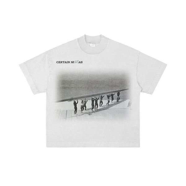 White oversized T-shirt with black and white graphic design and “Certain Necessities” text – premium West Coast streetwear tee for Los Angeles, San Diego, San Francisco, and Portland.