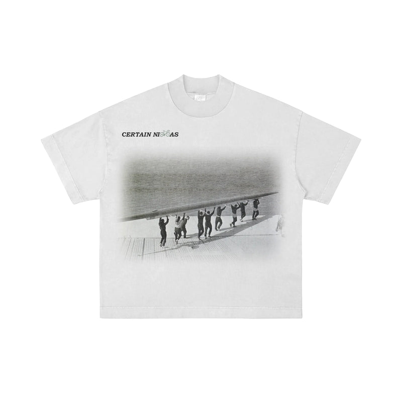 White oversized T-shirt with black and white graphic design and “Certain Necessities” text – premium West Coast streetwear tee for Los Angeles, San Diego, San Francisco, and Portland.